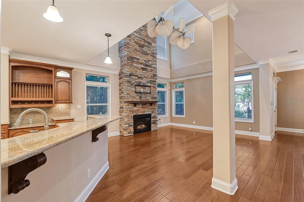 Partial Kitchen view with Family Fireplace Room.