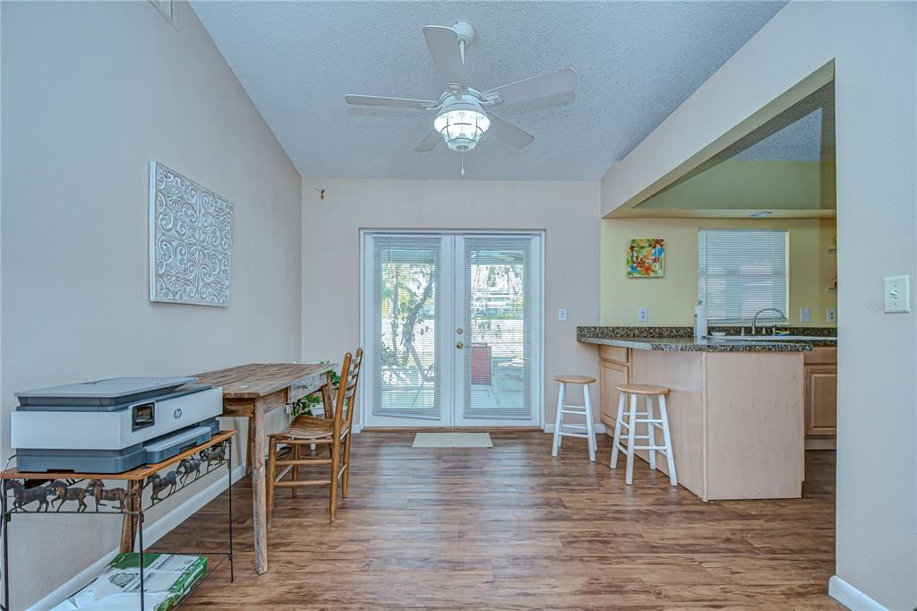 Cafe with Kitchen Breakfast Bar - French Doors to Lanai