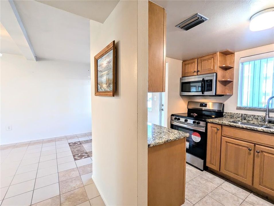 No carpeting in this condo, all very pretty tiled flooring throughout.