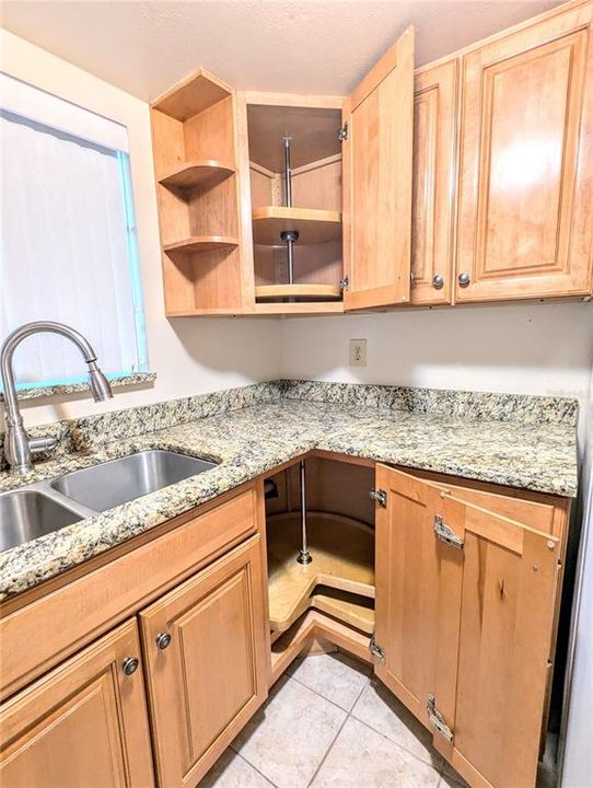 Upper and lower lazy susan cabinets adding additional storage.