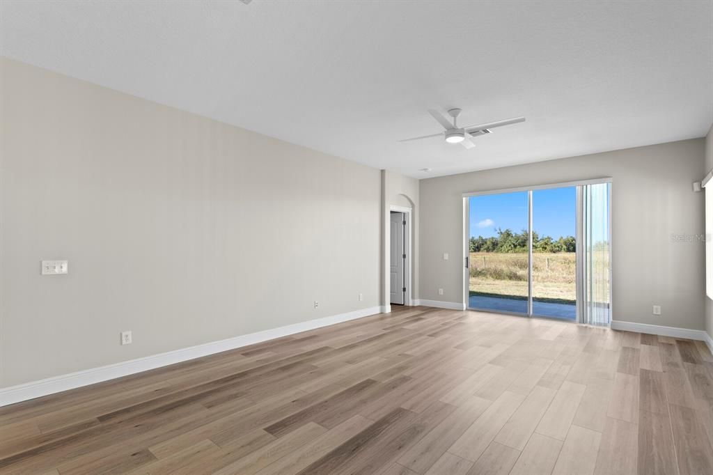 Views from the living room with sliding glass doors to the backyard