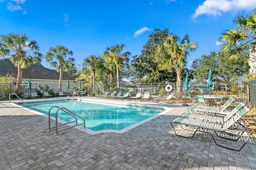 Relax on the paver deck at the community pool