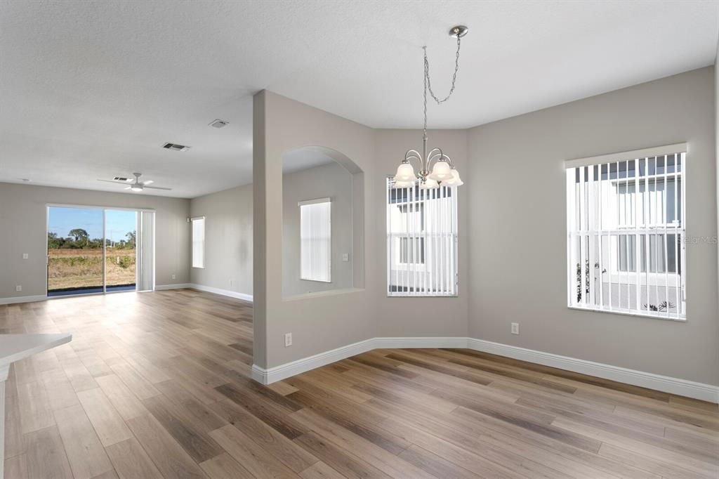 The large formal dining space is adjacent to the living room