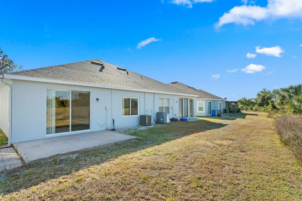 Views of the back of the home and patio