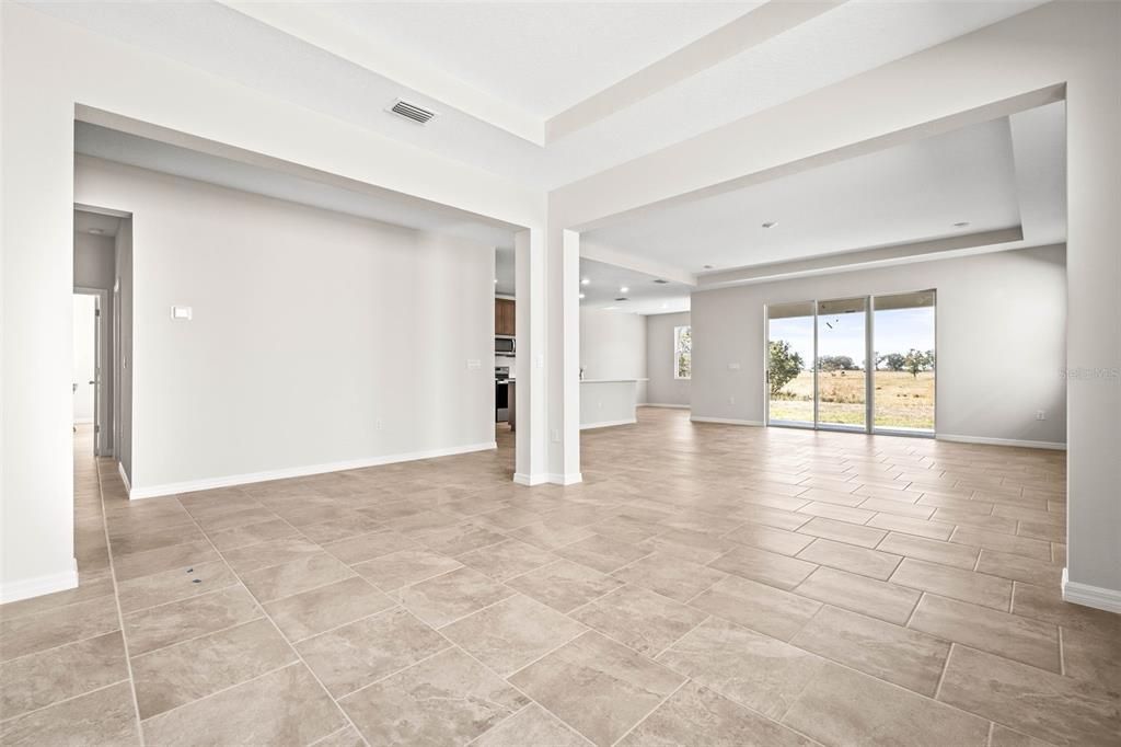 View from the dining area toward the kitchen and living room.