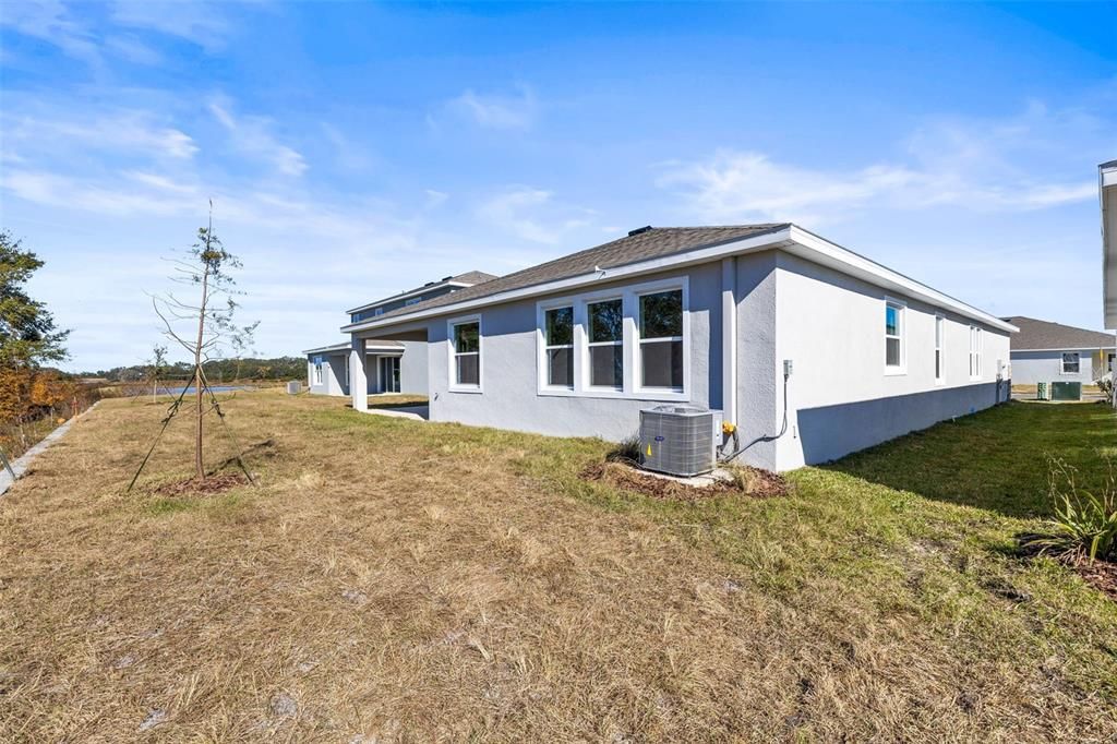 Large backyard with room to fence in, add a pool, or extend the lanai.