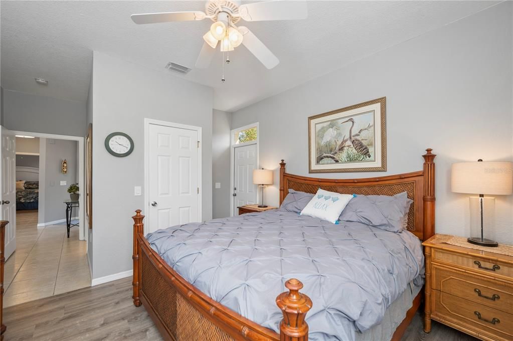 Master bedroom with view of walk in closet and door for private entrance.