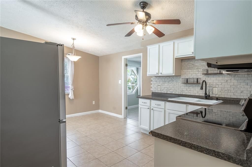 The kitchen is open to the dining area