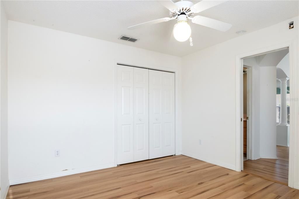 Second bedroom showing closet, second bathroom right outside bedroom door.