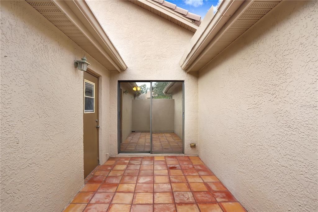 Entryway to courtyard is through sliders into office