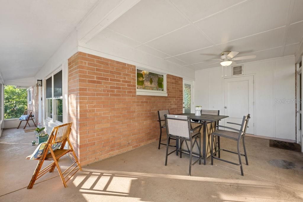 Carport is currently used as screened in porch space but can be easily converted back