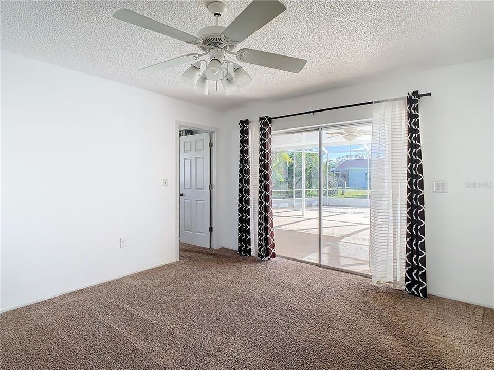 Dining Area with Sliders to the Lanai and Pool