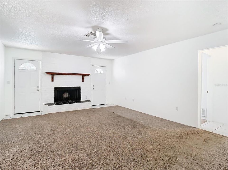 Family Room, door to the right leads to 2nd and 3rd Bedroom with Guest Bathroom and Linen Closet