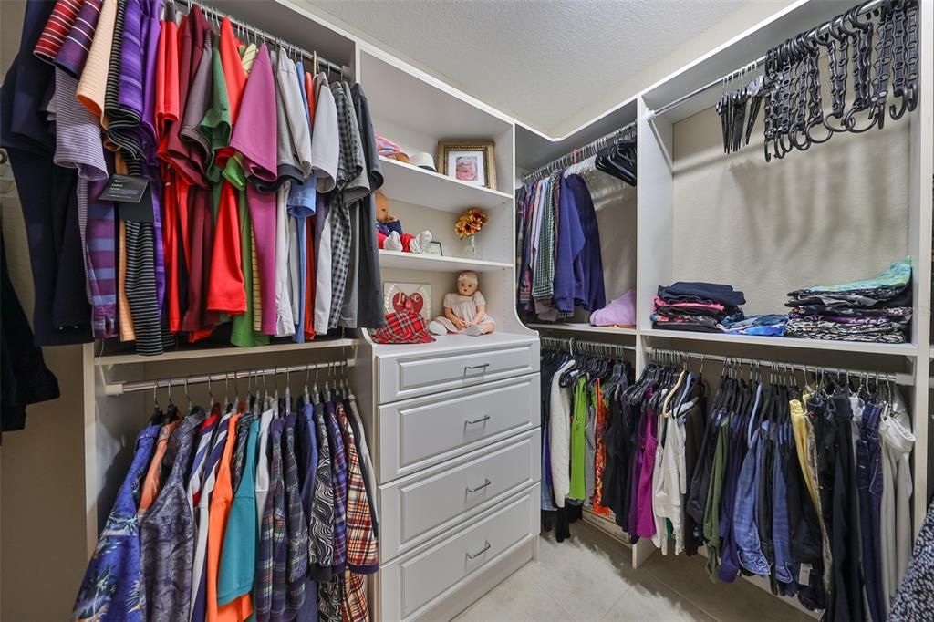 The master closet boasts of a "California Style" closet system.  In fact, ALL closets in this condo have custom shelving.