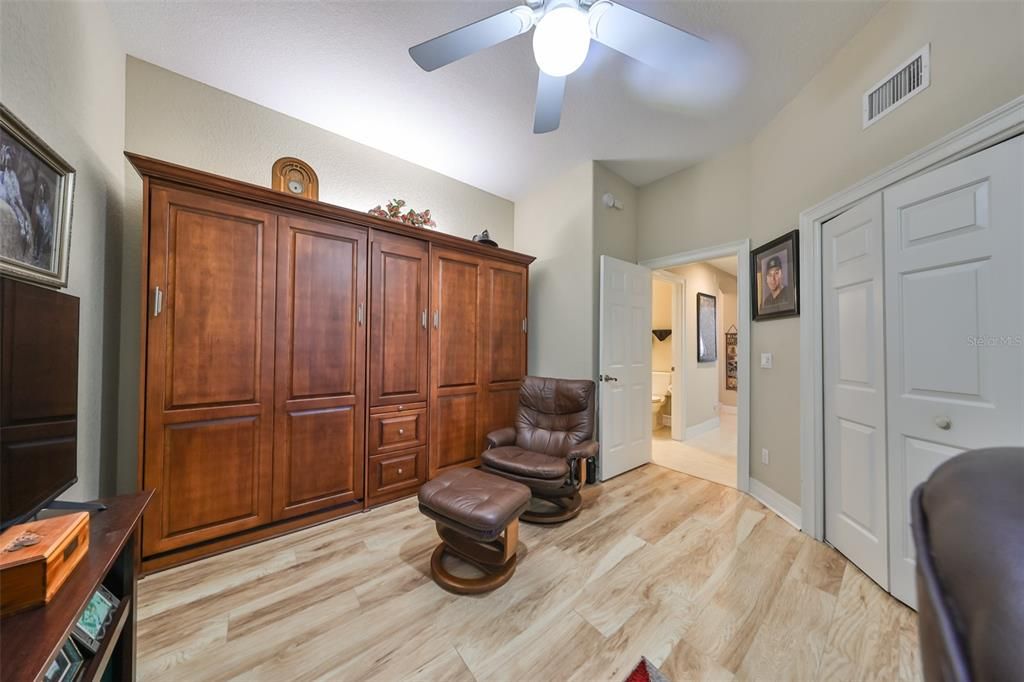 With beautiful flooring, ceiling fan and soft neutral colors.  It is perfect to relax in.  This room also has a built in Murphy bed with two twin beds on each end.