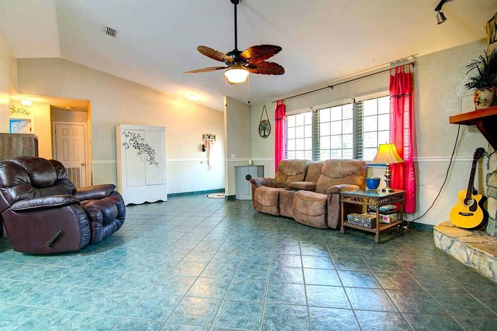 Living Room Entry with Bedrooms 2 & 3 and Lanudry beyond