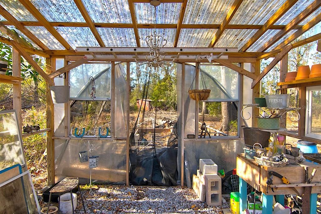 Greenhouse Interior Overlooking Raised Beds and Rear Acreage