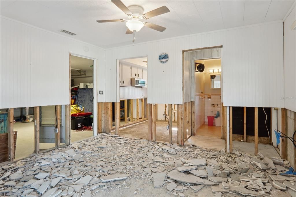 Dining room area with garage on far left, kitchen forward left, pool bathroom/2nd bathroom forward right