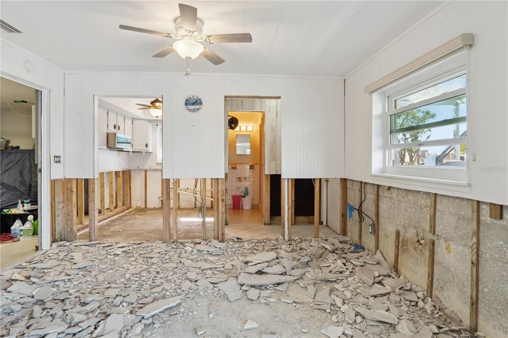 Dining room area with garage on far left, kitchen forward left, pool bathroom/2nd bathroom forward right