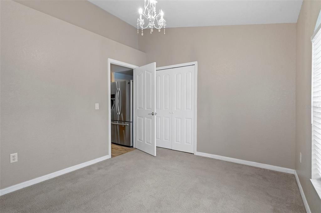 Bedroom Three has an elegant light fixture