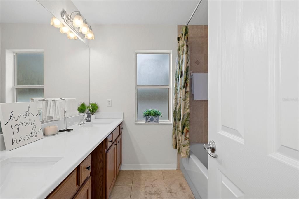 The Guest Bathroom has beautiful quartz countertops