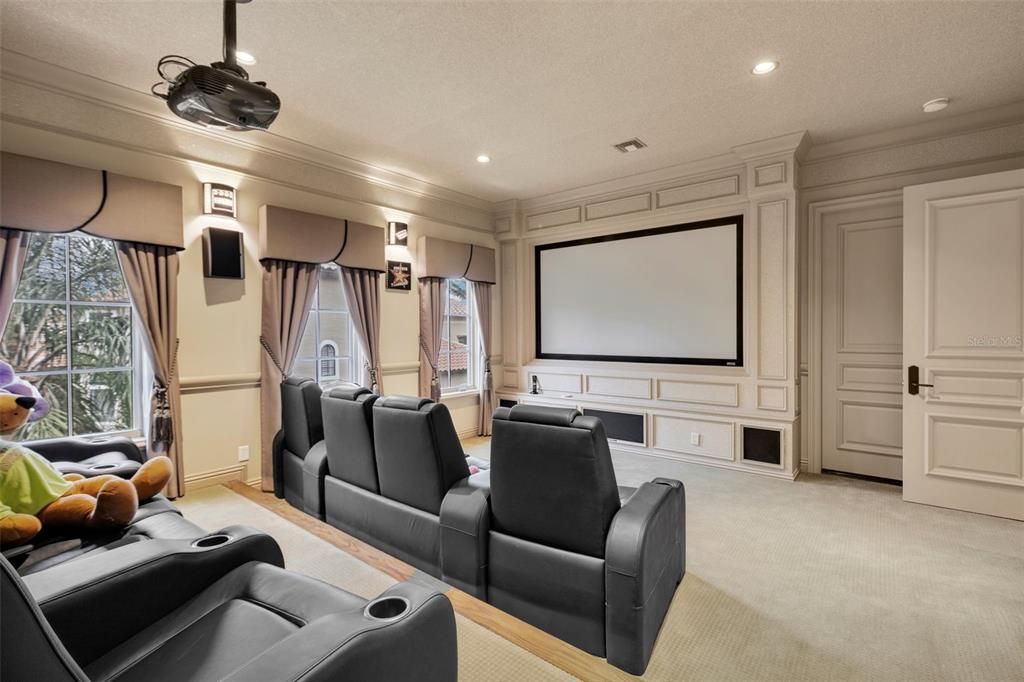 This large media room has space for bean bags and more seating