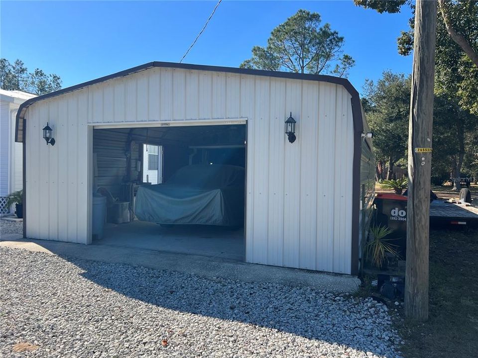 Second garage can hole 4 more cars with a working shop