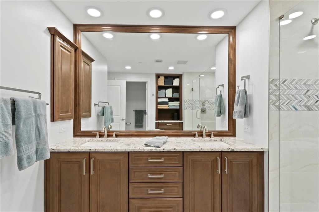 A fully renovated bathroom, with expanded shower, and enhanced built in storage.