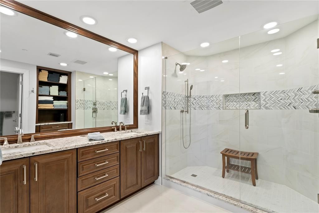 The oversized walk-in shower is roomy enough for those who like long . . . . . hot . . . . . showers (without feeling cramped)