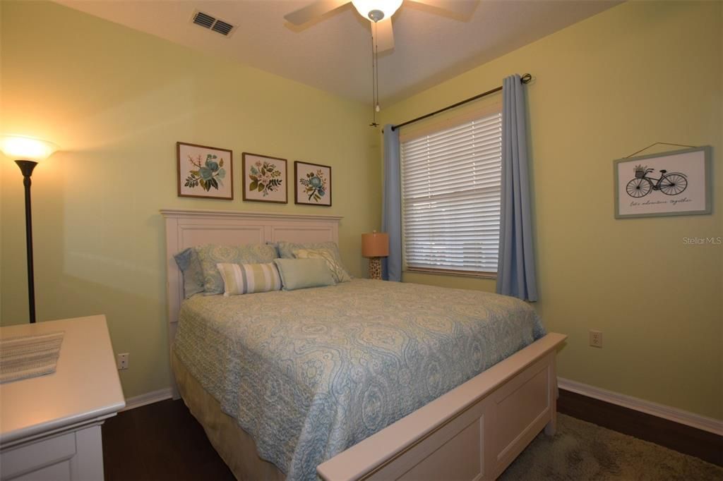 Large closet with double doors (not pictured) in front of dresser.