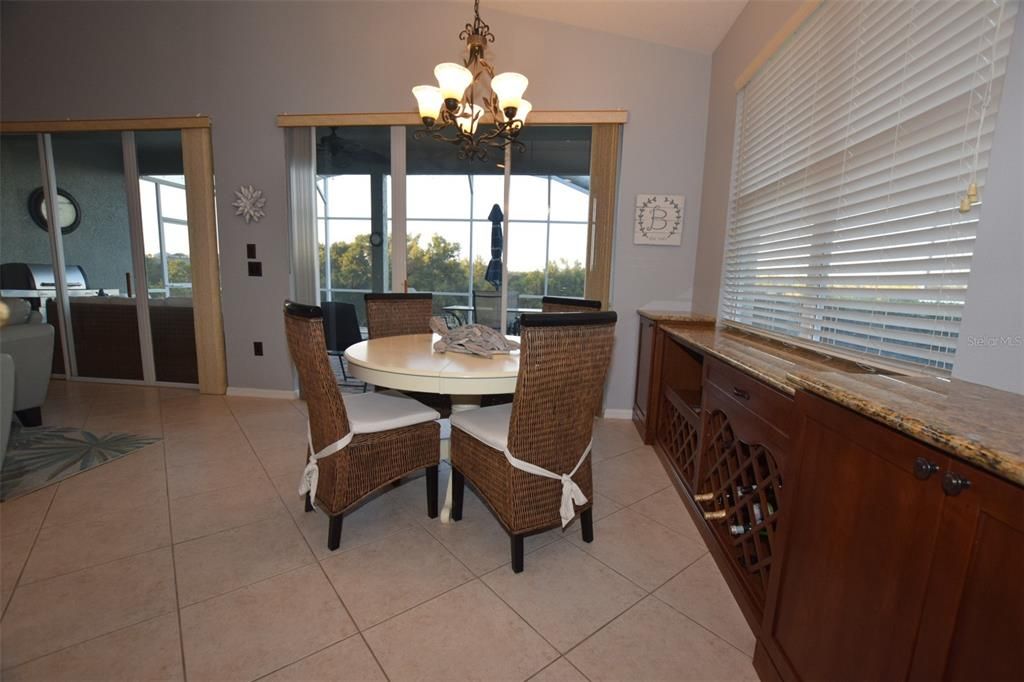 Cherry wood built-in cabinets with lots of storage & fantastic serving area for those entertaining.