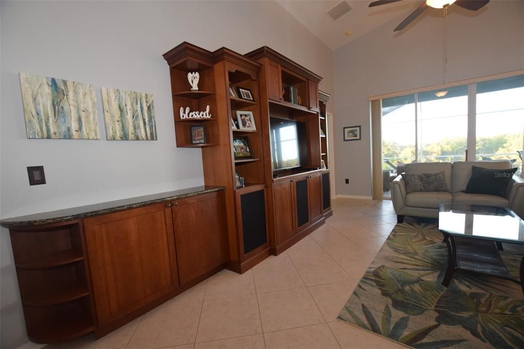 Custom Cherry wood built-in with beautiful stone countertops.