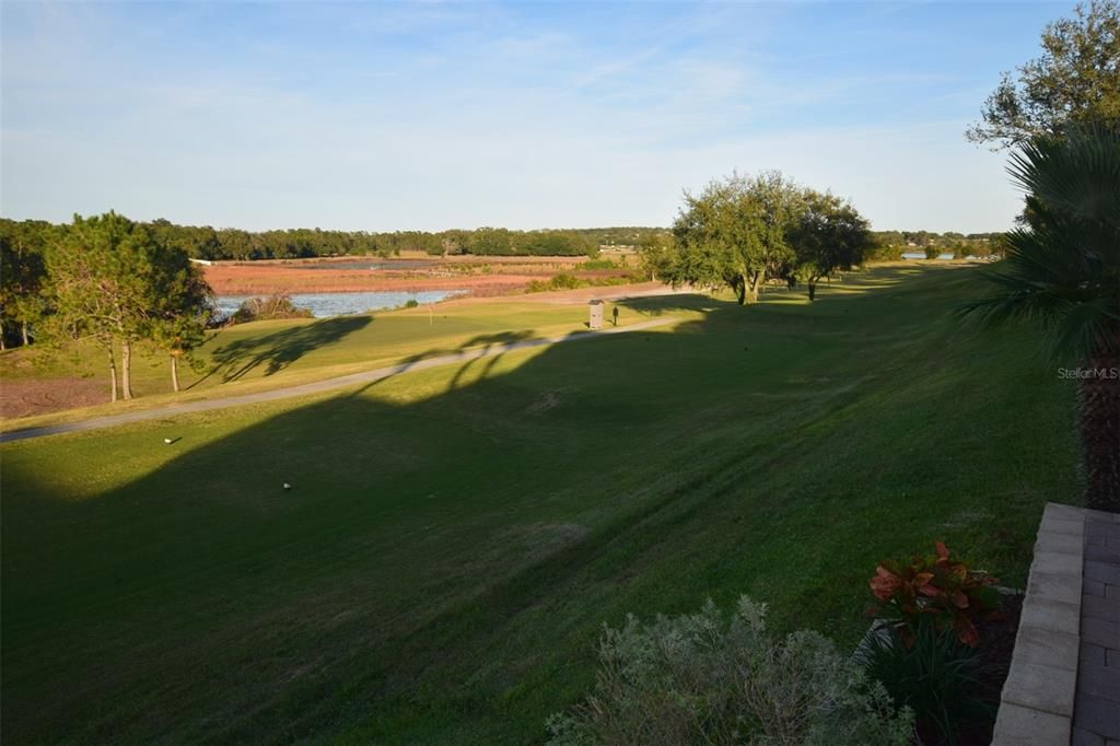 Panoramic views facing east from back patio towards 12th hole.  Come July 4th, you can enjoy the fireworks from at least 3-4 cities right from your patio.