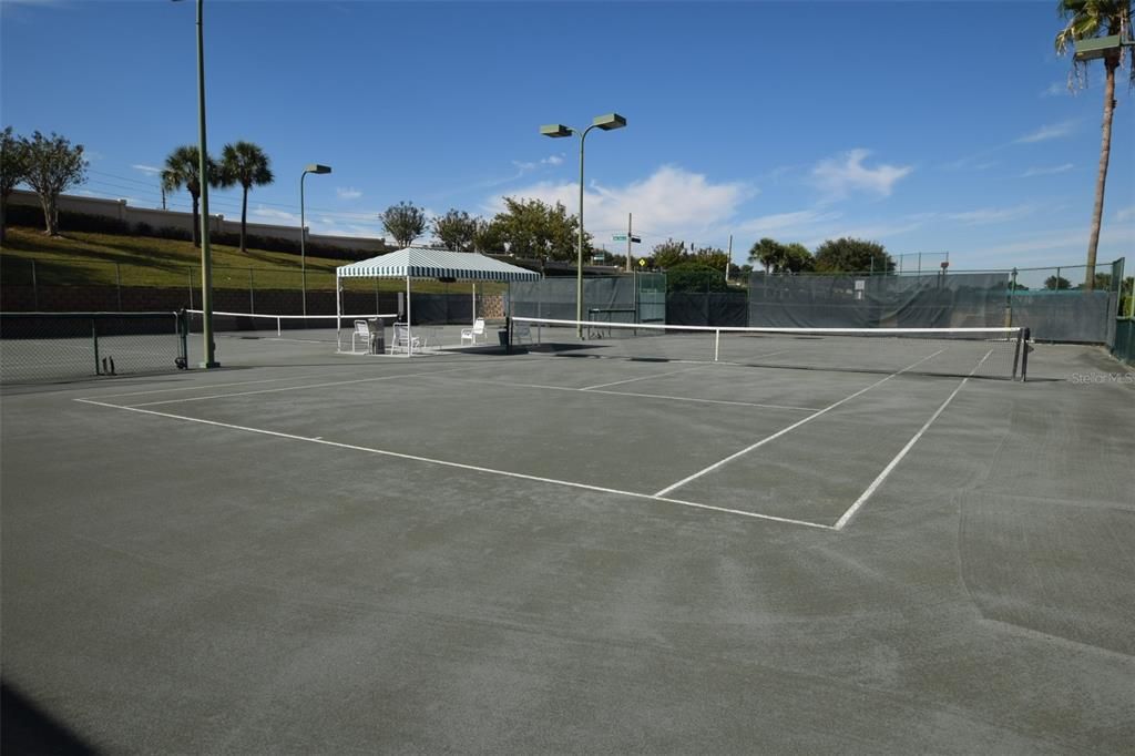 The coveted clay tennis courts of Summit Greens. Image 2 of 2