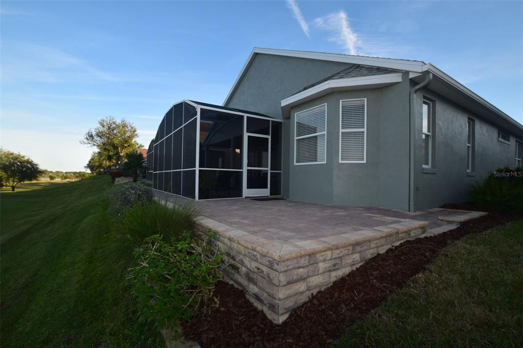 View of rear of patio. Screen enclosure has 2 entrances (on both sides of the patio)