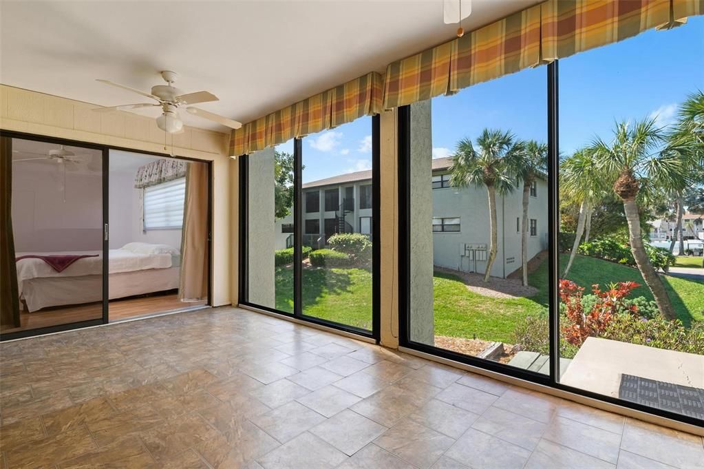 Lanai with sliders to the primary bedroom and out side area