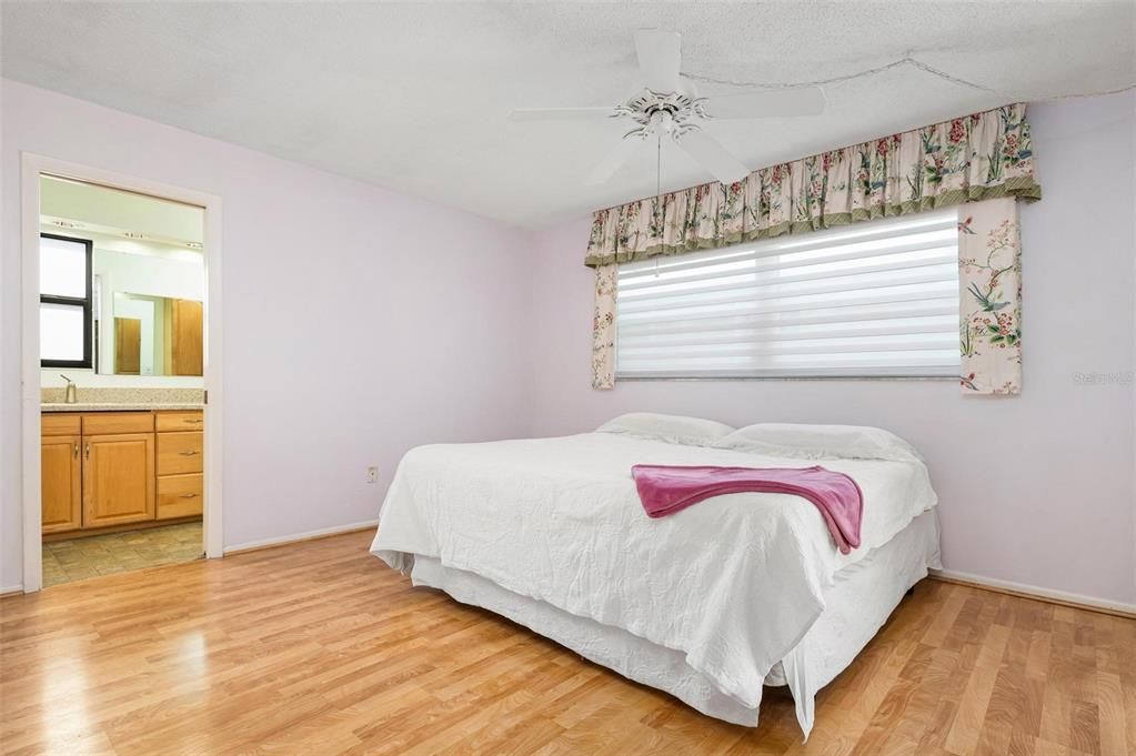 Primary bedroom with ensuite bath and walk in closet