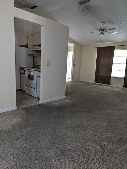 view from sliding door to porch looking to front of living room