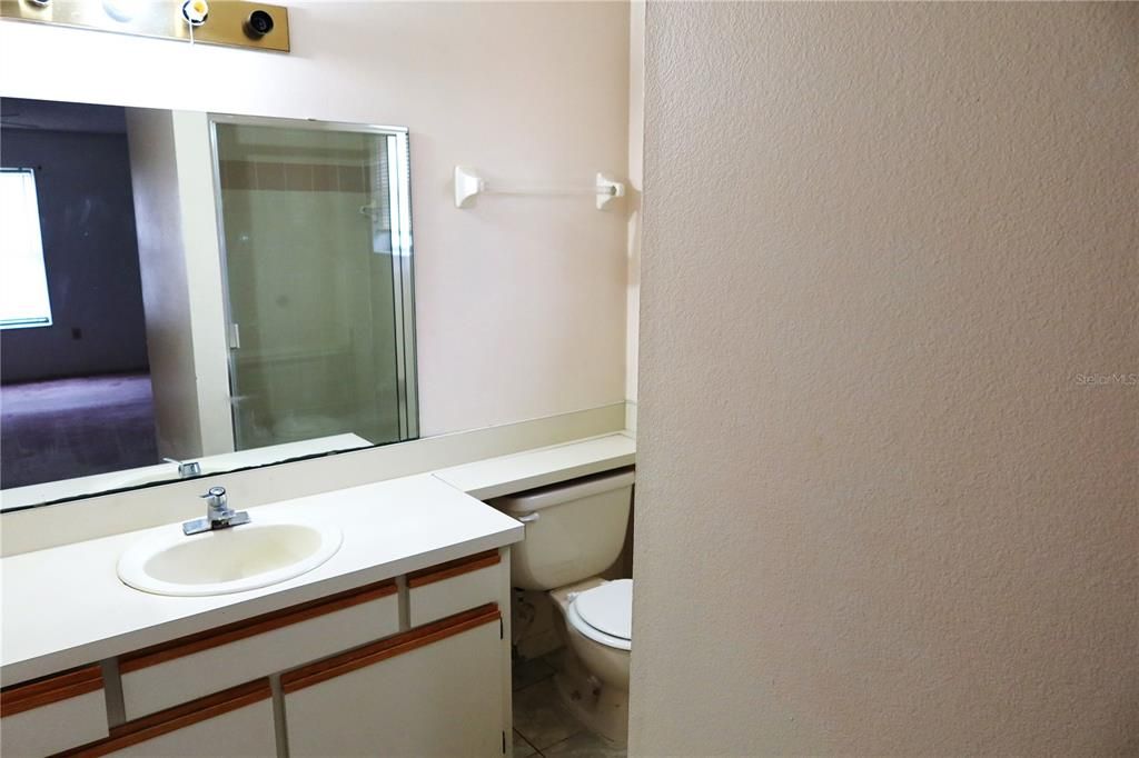 master bath, single sink, shower stall to the right