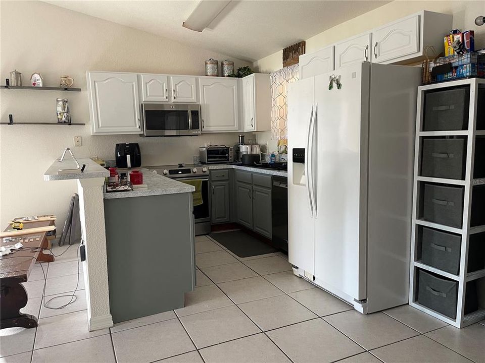 updated kitchen  Cabinets white on top/ gray on bottom