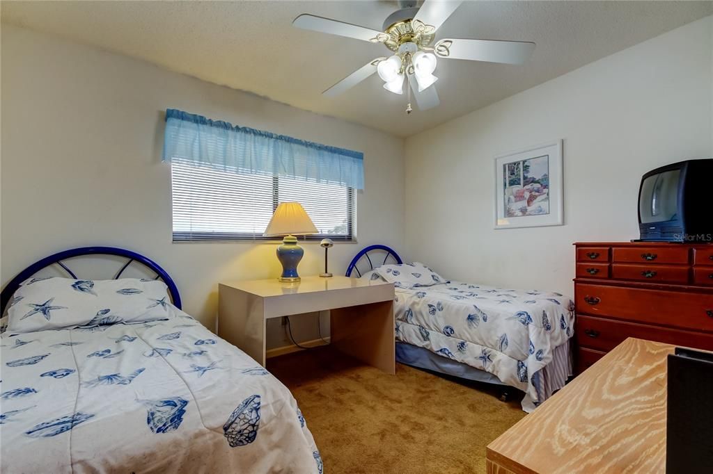 42. Guest Bedroom (10.2' x 11.10') is On West Wall.. Features Large Walk In Closet & 2 Cool Twin Beds for Guests!