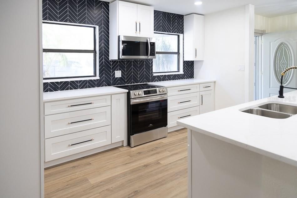 New cabinets, countertop fixture and mirror