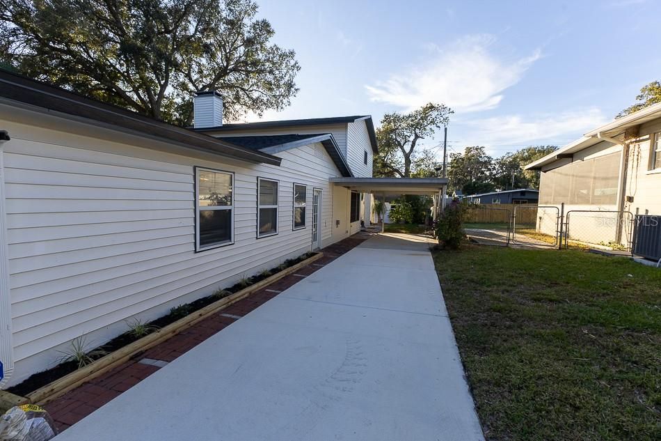 Extended driveway with carport