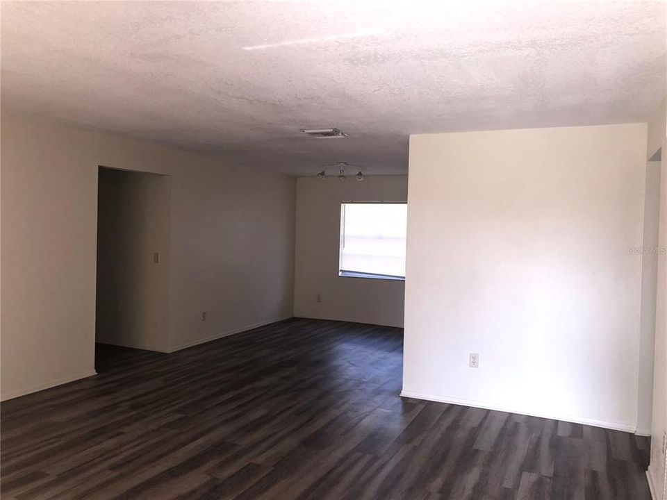 Front Entrance View of Living Room and Dining Area