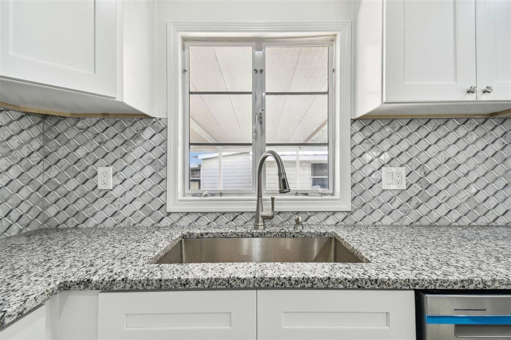 Large kitchen sink and gorgeous backsplash!