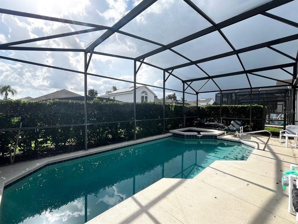 Enclosed pool with hot tub