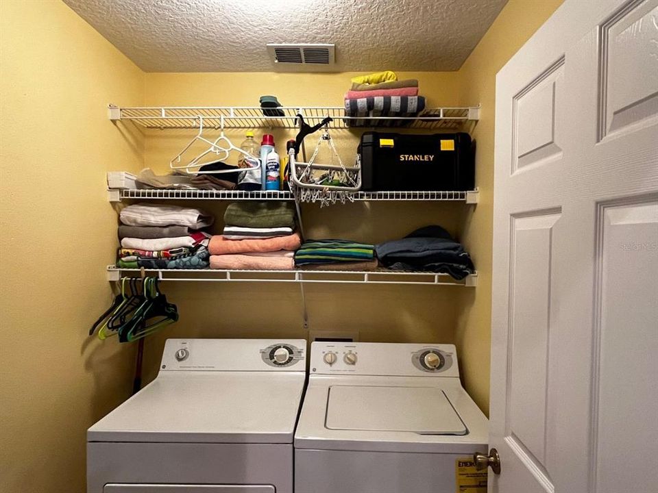 Inside laundry room off of kitchen