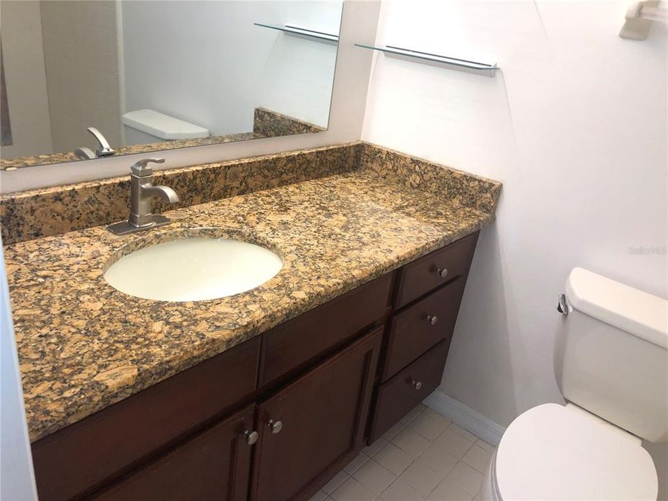 Primary Bathroom Stone Counter + Cabinet