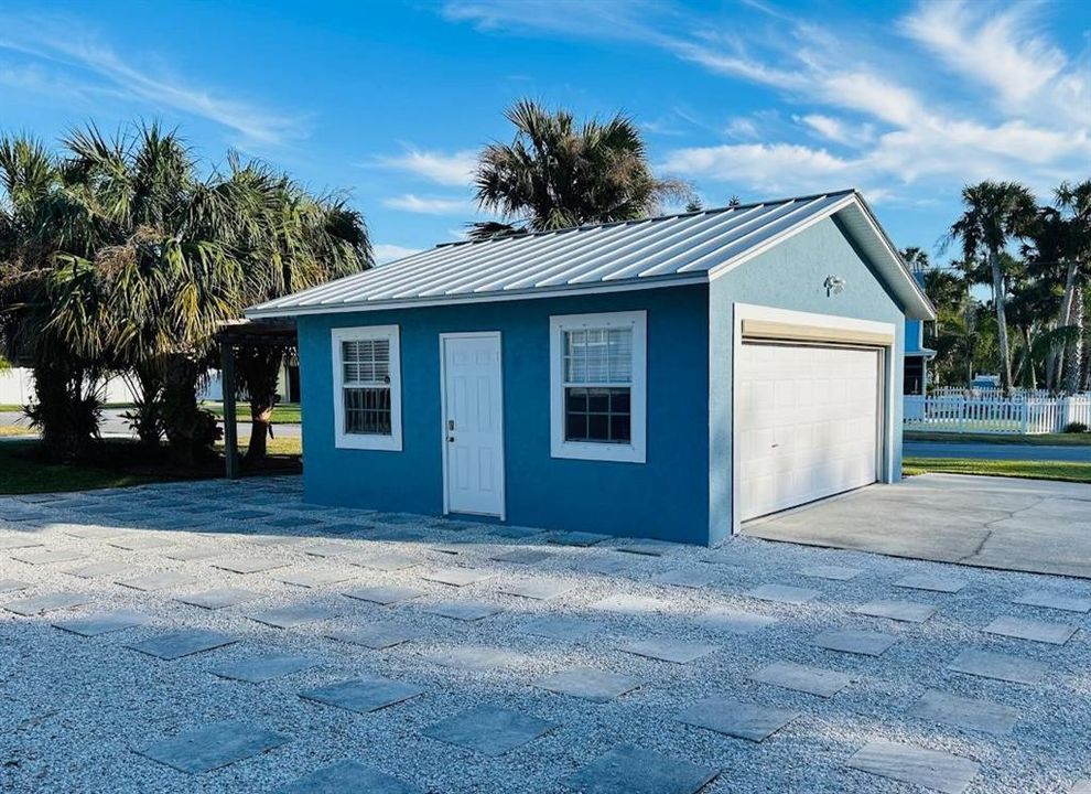 Two Car Garage and Open Hardscape Yard