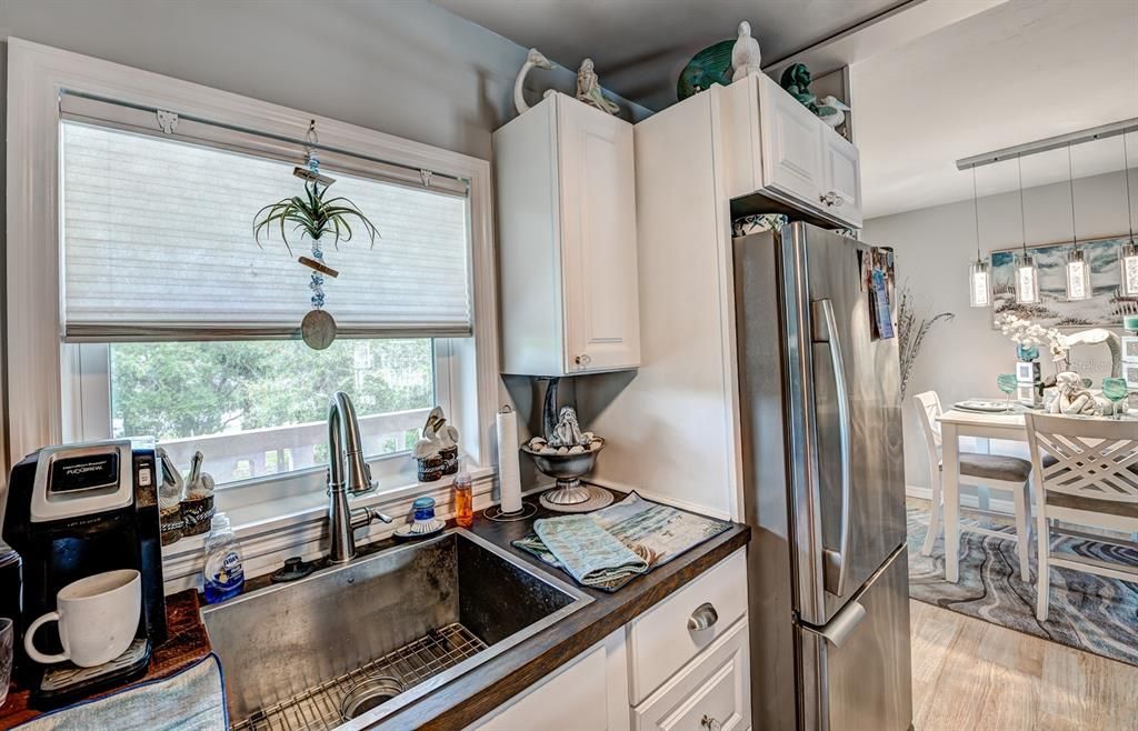 The chef of the family will love the large kitchen sink and natural light from its window above.